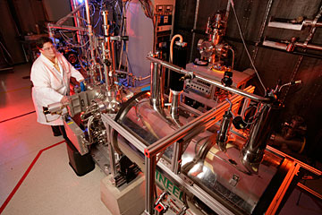 INL scientist Jill Scott operates a laser instrument that can detect minuscule traces of cells in mineral samples.