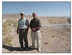 ORNL's Jim Terry and project leader Bill Hermes pay respects at the final resting place of 7 million pounds of thorium nitrate at the Nevada Test Site.