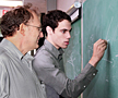 PPPL's Nathaniel Fisch (left) and graduate student Abraham Fetterman at the chalkboard.