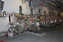 A new cryomodule, a section of Jefferson Lab's CEBAF accelerator, is shown during installation.