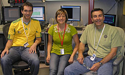 Three members of the Leiske family – son Christopher (left), daughter Danielle and father Daniel – pause during their work at Beam Line 1-4 at the Stanford Synchrotron Radiation Lightsource to pose for an impromptu family portrait.