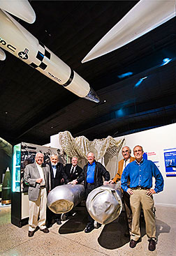 Six active and retired Sandia National Laboratories employees gathered in 2011 at the National Museum of Nuclear Science & History in Albuquerque, N.M., around two B28 gravity bombs recovered from a 1966 nuclear accident over Palomares, Spain. They are, from left, Stan Spray, Leon Smith, who died in 2012, Dan Summers, Ray Reynolds, Bill Stevens and Bob Bradley. They are among the 42 people — including key policymakers, scientists and engineers — who appear in the Sandia video, Always/Never: The Quest for Safety, Control and Reliability. (Photo by Randy Montoya)