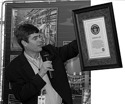 Lab Director Thom Mason displays the world-record plaque from Guinness.