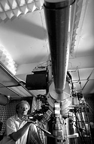 Steve Pennycook adjusts the 300-kilovolt Z-contrast scanning transmission electron microscope.
