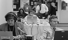 Members of the Washington press corps made themselves at home in the Central Research Library, which served as Communications Center and satellite White House Press Office during President Bushs visit.