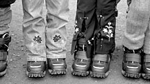 Moldovan children sport boots given to them by Childrens Emergency Relief International. Many children learn embroidery, as seen here on their pants, as a vocation.
