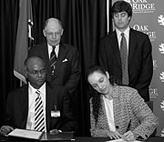 Signing the SuperPower agreement are (from left) SuperPower's Selva Selvamanickam, ORNL Partnerships Director Tom Ballard, DOE Principal Deputy Assistant Secretary for Electricity Delivery and Energy Reliability Patricia A. Hoffman and ORNL Director Thom Mason.