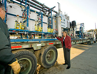 Robin Newmark of LLNL’s Global Security Directorate inspects the water units.