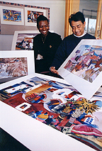 Argonne architect Ratindra Das shows some samples of his watercolors to Gwendolyn Morrison, director of Argonne's Plant and Facility Services Division.