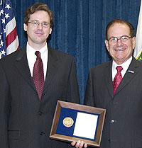 John Arrington receives the award from The Director of the Department of Energy�s Office of Science, Dr. Raymond L. Orbach.