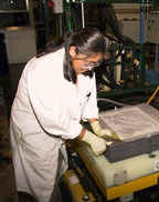 Chemical Engineer, Paula Moon inspects the EDI wafer stack.