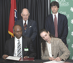 On hand for the Jan. 9 signing of the licensing agreement to use ORNL-developed superconducting wire technology were (from left) ORNL Partnerships Director Tom Ballard; SuperPower, Inc., Vice President and Chief Technology Officer Venkat Selvamanickam; ORNL Director Thom Mason; and DOE Principal Deputy Assistant Secretary for Electricity Delivery and Energy Reliability Patricia A. Hoffman.