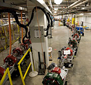 The FEL ultraviolet beamline, with prominent red and green magnets, juts out to the right. On the left, the infrared beamline also extends nearly the length of the room.