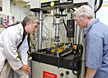 LLNL researchers Mike King (left) and Willy Moss (right) test the impact response of a helmet pad system.