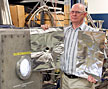 ORNL researcher Steve Combs holds target materials for evaluating pellet size.