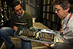 Fermilab’s Amitoj Singh and Don Holmgren examine one of the new GPUs used for lattice QCD calculations. Photo: Brad Hooker