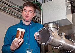 Erik Gilson with a copper-clad module and chamber for testing the units. (Photo credit: Elle Starkman, PPPL Office of Communications)