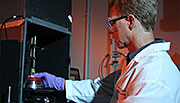 Greg Klunder, a chemist in LLNL's Forensic Science Center, examines a uranium ore concentrate sample with the aid of a near-infrared spectrometer.
