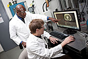 Dr. Isaac Gamwo (left) works with Dr. Ward Burgess (right) at the National Energy Technology Laboratory.  Photo Credit: NETL.
