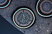 Micrograph of an irradiated fuel pellet containing TRISO particles, which have layers of carbon and carbide that serve as the primary containment for radioactive material.