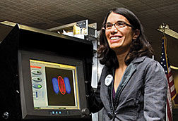 Los Alamos physicist Michelle Espy demonstrates use of a magnetic field detector to screen carry-on liquids at airports.