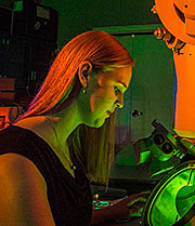 Katie Jungjohann at work on the Center for Integrated Nanotechnology’s transmission electron microscope. CINT is a user facility operated by Sandia and Los Alamos national laboratories for the Department of Energy’s Office of Science. (Photo by Randy Montoya)