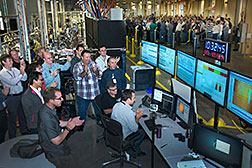 The team of scientists, engineers, and technicians at the Coherent Soft X-ray Scattering (CSX) beamline gathered around the control station to watch as the shutter between the beamline and the storage ring opened, allowing x-rays to enter the first optical enclosure for the first time.