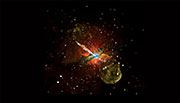 The Centaurus A galaxy, at a distance of about 12 million light years from Earth, contains a gargantuan jet blasting away from a central supermassive black hole. In this image, red, green and blue show low, medium and high-energy X-rays. Photo courtesy NASA/CXC/U. Birmingham/M. Burke et al.