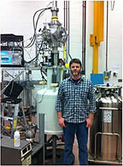 PNNL Physicist Brent VanDevender with the Cyclotron Radiation Emission Spectroscopy apparatus used to measure the energy of a single electron from decaying Krypton-83m.