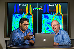 Argonne principal mechanical engineer Sibendu Som (left) and computational scientist Raymond Bair discuss combustion engine simulations conducted by the Virtual Engine Research Institute and Fuels Initiative (VERIFI). The initiative will be running massive simulations on Argonne’s Mira supercomputer to gain further insight into the inner workings of combustion engines.