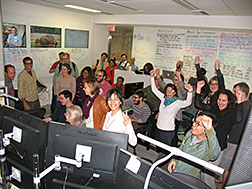 Scientists celebrate the arrival of the first neutrino beam at the MicroBooNE detector.