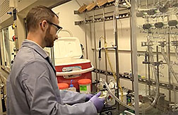 ORNL researcher Carter Abney in his lab.