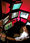 An operator works at a control console.