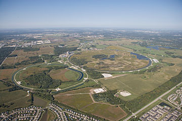 Aerial of the Fermilab accelerator complex, including the Tevatron (large ring on the right)