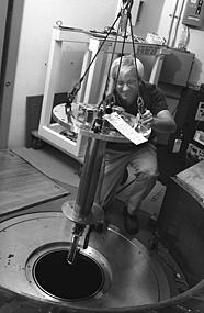 Doug Abernathy assembles part of the sample chamber of ARCS, a wide angular-range chopper spectrometer at the Spallation Neutron Source. ARCS was one of the first of the SNS’s research instruments to come on line.