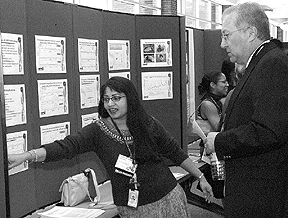 The Environmental Sciences Divisions Madhavi Martin explains her poster to Biological and Environmental Sciences Associate Laboratory Director Reinhold Mann.