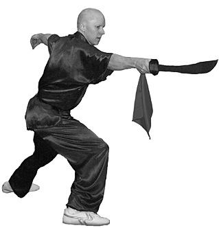 The Physics Division's Michael Smith surely wouldn't hurt a fly, but he struck this fearsome pose while performing for the Asian Pacific American Heritage festival May 17 in the Research Support Center. Michael demonstrated wu-shu, or a kung-fu routine with a Chinese broadsword, or dao. Michael's spouse is Chang- Hong Yu, shown on page two. He says she got him interested in wu-shu, but stays well clear when he rehearses.