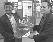 Thomas Zacharia receives his award from HPCwire publisher Tom Tabor.