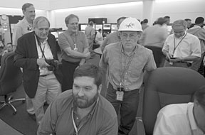 Jack Carpenter (top photo, left,  dark blazer), Tony Gabriel, Erik Iverson, Rick Reidel (hard hat) and Ian Anderson (with PDA) watch readings on the instrumentation panel. (Below) Frank Kornegay, Rob Taylor and Mike Plum monitor progress over at the physics diagnostics station.