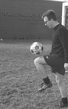 European by birth and nature, David Silvermyr practices his futbol skills on the field near his Physics Division office.