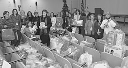 Associate Lab Director Michelle Buchanan (center left) joined Angel Tree donors and committee members at the gift drop-off.
