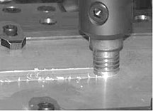 The business end of a friction-stir welding tool plows through a sample. The process avoids changes in materials properties caused by melting.