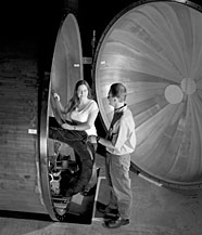 The Neutron Scattering Sciences Divisions Daniel Maierhafer and Katherine Atchley examine one of the small angle neutron scattering tanks.