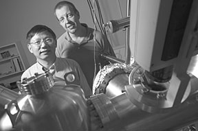 By manipulating quantum properties of materials, Hanno Weitering (right) and Zhenyu Zhang are taking a novel approach toward a hydrogen storage technology.