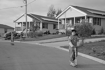 Kids play in front of Near-Zero-Energy homes in Lenoir City. It looks like any typical neighborhood, except for the solar collectors on the roofs... and the ridiculously low summer electricity bills.