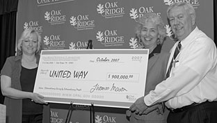 ORNL United Way Campaign Chair Karen Downer (left) presents a ceremonial check to Anderson County United Way Campaign co-chairs Kay Brookshire and Oak Ridge Mayor Tom Beehan. 