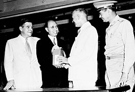 They must have known: All were smiling in August 1946 when ORNL  science director Eugene Wigner (dark suit) handed over the first shipment of radioisotopes for medical use.